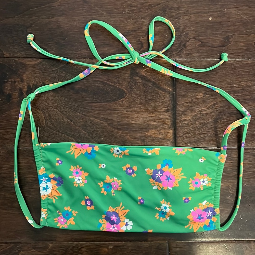 Super cute green bikini top. It is brand new never worn but with no tags.